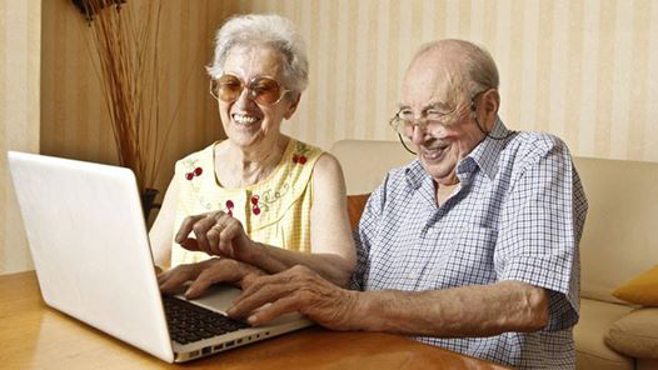 two elderly on a computer. alert1 medical alert systems